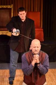 Hamlet (Michael J. Dombroski) ready to strike vengeance upon Claudius (William Cassidy) for the murder of King Hamlet