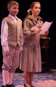 Michael (Gavin Willard) and Jane (Samantha Yakaitis) reading their advertisement for "A Perfect Nanny" 