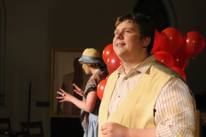 Bobby Henneberg as Jean-Pierre the Balloon Vendor with Cassandra Dutt as Deedee, the world's most beautiful girl in 13 Dead Husbands at Cohesion Theatre Company