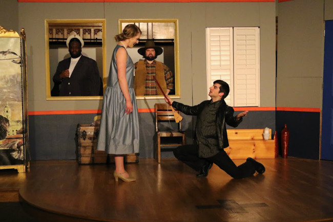 Portraits of her dead husbands, Captain Alexander Coachella (Left frame- Sean Jeams) and Jack Russel (Right frame- Nick Delaney) watch on as Marcel (Right- Matt Payne) woos Deedee (Left- Cassandra Dutt) in 13 Dead Husbands at Cohesion Theatre Company