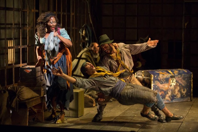 Amber Iman as Aldonza, James Hayden Rodriguez as Jose, Nathan Lucrezio as Anselmo, and Dan Sharkey as The Governor in the Shakespeare Theatre Company’s production of Man of La Mancha, directed by Alan Paul