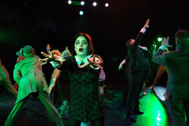 Wednesday Addams (MaryKate Brouillet) dances the Death Rattle during "When You're an Addams"