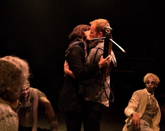 Wednesday Addams (L- MaryKate Brouillet) kisses Lucas Beineke (R- AJ Whittenberger) while the Addams Ancestors (L to R Jeffrey Shankle, Heather Beck, Andre Hinds) look in in amazement