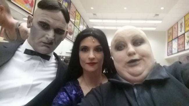 Lurch (L- Mark Lloyd) Morticia (C- Tatiana Dalton) and Uncle Fester (R- Kristen Cooley) preparing for an evening of creepy kookiness!