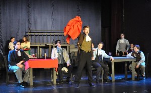 Enjolras (Center- Josh Starkey) leads the students to revolution with his rendition of "Red and Black" 