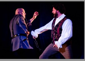 Lance Bankerd as Javert (left) and Lee Lewis as Jean Valjean (right) in Les Miserables at Milburn Stone Theatre