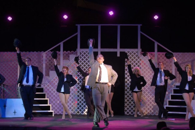 Joshua Mooney (center) as Carl Hanratty and the Frank Abagnale Jr. singers and dancers