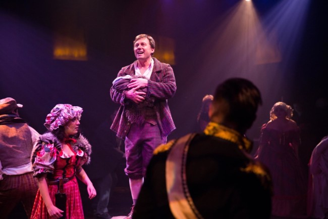 Jeffrey Shankle (center) as The Baker and The Company of Into the Woods