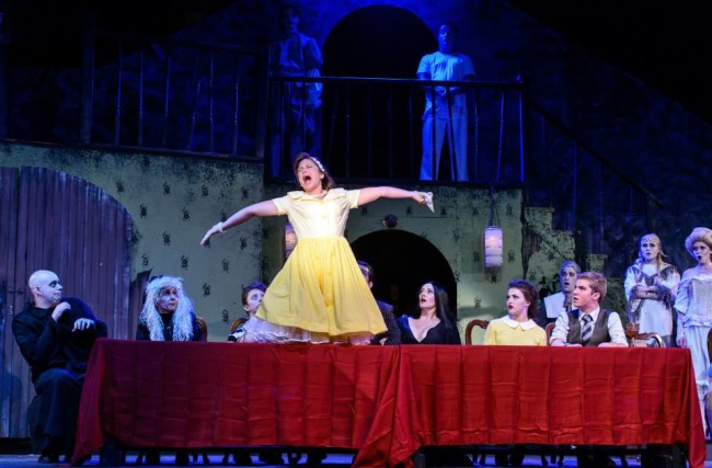 Andrea Ostrowski Wildason (center) as Alice Beineke and the company of The Addams Family during "Waiting" 