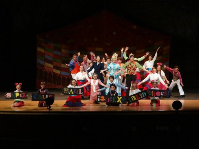 The company of Mary Poppins at September Song in Mrs. Corry's talking shop, singing "Supercalifragilisticexpialidocious"