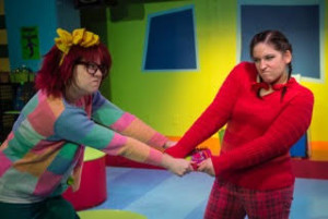 Emily Raines (left) as Junie B. Jones and Tori Weaver (right) as May in Junie B. Jones Jingle Bells Batman Smells at MET's Fun Company