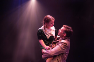 Lilianna Robinson (left) as Zuzu and Matthew Schleigh (right) as George Bailey in It's a Wonderful Life: The Musical