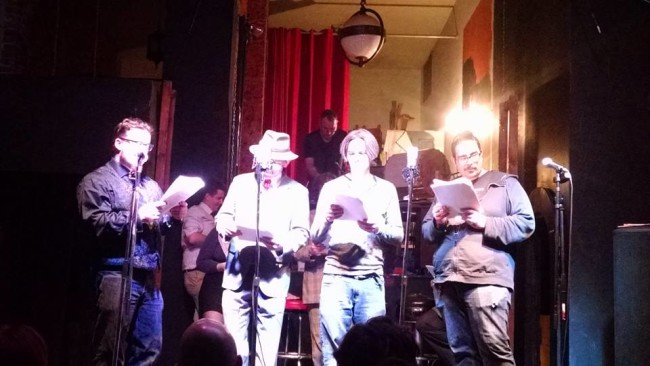 (L to R) Todd Gardiner, Doug Johnson, Mike Jancz, and Aaron Travis reading "Chap Sweat: Home Harvest" written by Chaz Kedesla