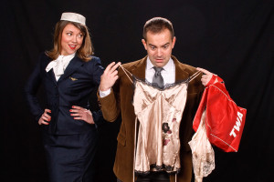 Debra Kidwell (left) as Gloria and Colin Hood (right) as Robert in Boeing Boeing