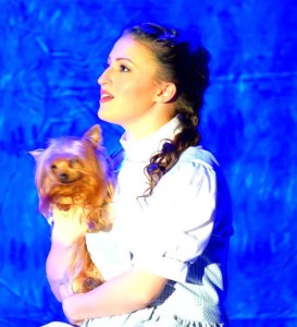 Lucy Bobbin as Dorothy with Summer Johnson as Toto in The Wizard of Oz at Suburban Players