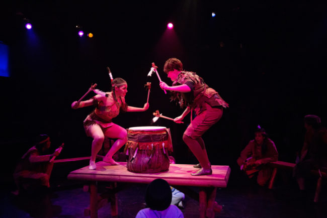 Amanda Leigh Corbett (left) as Princess Tiger Lily and MaryKate Brouillet (right) as Peter Pan drumming to "Ugh-A-Wug" in Peter Pan