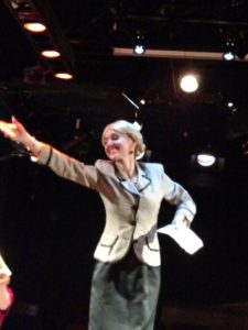 A tech-week rehearsal photo of Becca Vourvoulas as Eva in Evita at Spotlighters Theatre