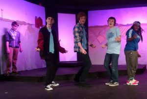 (L to R) Pierce Elliott (on the wall) as Evan, Jake Schwartz as Bret, Jake Clark as Ritchie, Aidan Slowey as Malcolm, and Maren Wright-Kerr as Eddie in 13: The Musical