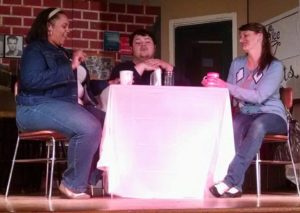 Lydia West (left) as Carley, Jason Crawford Samios-Uy (center) as Logan, and Jennifer Skarzinski (right) as Michelle in The Coffee Shop