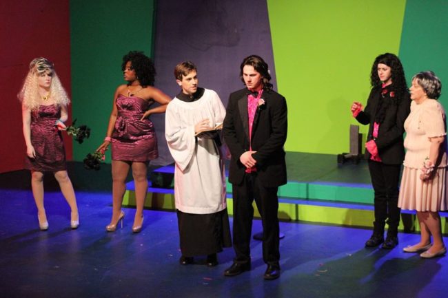 Jamie Austin Jacobs (center right) as Robbie Hart in The Wedding Singer at ASGT