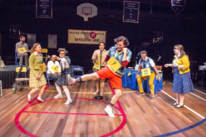 Cole Richard Watts (center) as Leaf Coneybear and the cast of The 25th Annual Putnam County Spelling Bee