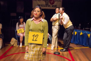 Kaity Krull (front left) as Logainne Schwartzandgrubenierre with Diego Esmolo (back left) as Carl Dad and Daniel Johnston (back right) as Dan Dad