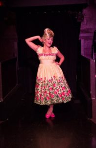 Gabriella DeLuca as Amber Von Tussle in Hairspray at Toby's Dinner Theatre