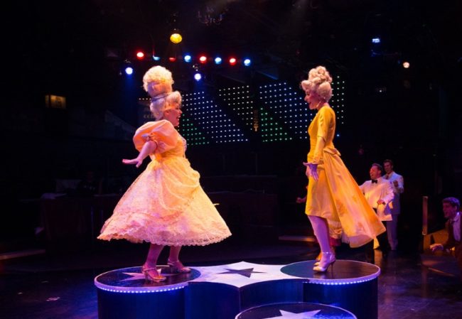 Gabriella DeLuca (left) as Amber Von Tussle and Heather Marie Beck (right) as Velma Von Tussle in Hairspray