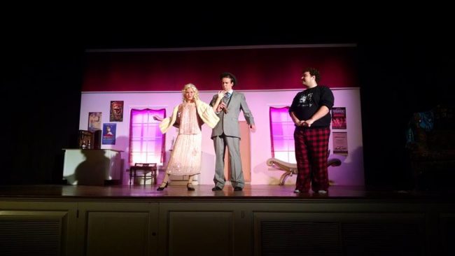 Lydia Newman (left) as Kitty, Zach Roth (center) as Feldzieg, and Jenna Buzard (right) as Man in Chair