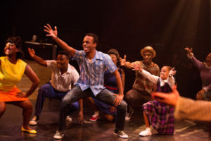 Andre Hinds (center) as Seaweed J. Stubbs in Hairspray