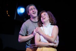 Chris Rudy (left) as Bobby Strong and Suzanne Lane (right) as Hope Cladwell in Urinetown: The Musical