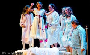 Julie Parrish (center) as Maria and the von Trapp children singing "The Lonely Goatherd"