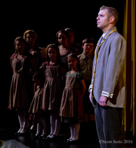 The von Trapp family singers (left) and Tyler Daniel Zeisloft (right) as Captain Georg von Trapp