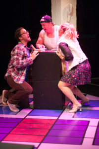 Garrett Zink (left) as Jon, Rob Wall (center) as Counter Guy and Clare Kneebone (right) as Karessa