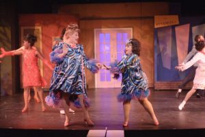 Larry Munsey (left) as Edna Turnblad and Celia Blitzer (right) as Tracy Turnblad in the 2012 Toby's Dinner Theatre of Baltimore production of Hairspray