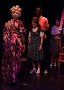 Kelli Blackwell (left) as Motor Mouth Maybelle, with Sophie Schulman (center) as Penny, Andre Hinds (right) as Seaweed and Samantha McEwen (far right) as ensemble in Hairspray