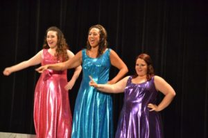 Chelsea Paradiso (left) Lisa Spera (center) and Kelsey Mai Jerzierski (right) as The Narrators