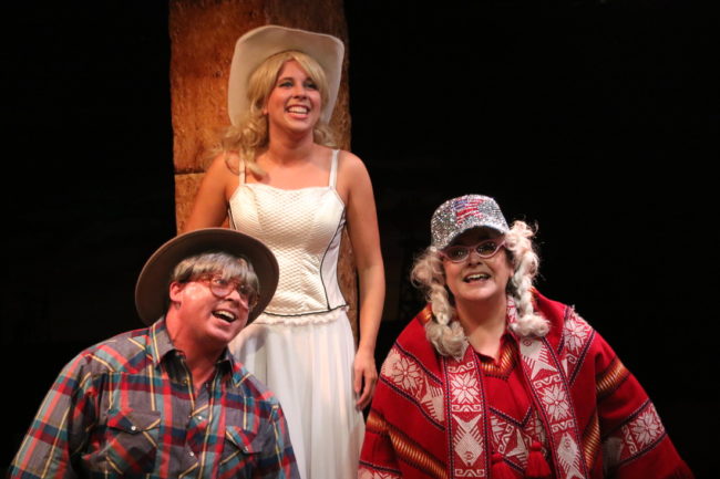 Rob Wall (left) as Milam Lamar, Allison Comotto (center) as Gutrune, and Andrea Bush (right) as Needa Trout