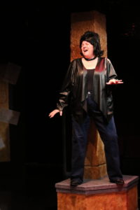 Andrea Bush as Backup Singer in Das Barbecü at Spotlighters Theatre