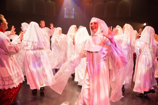 Erica Clare (center) as Sister Mary Rita of the nunsemble in Sister Act at Toby's Dinner Theatre