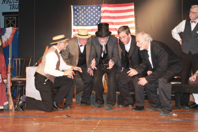 Rodney Bonds (center) as Mayor Shinn and the members of the School Board in Music Man