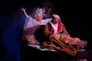 Heather Beck (left) as Ghost of Christmas Past and David Bosley-Reynolds (right) as Scrooge