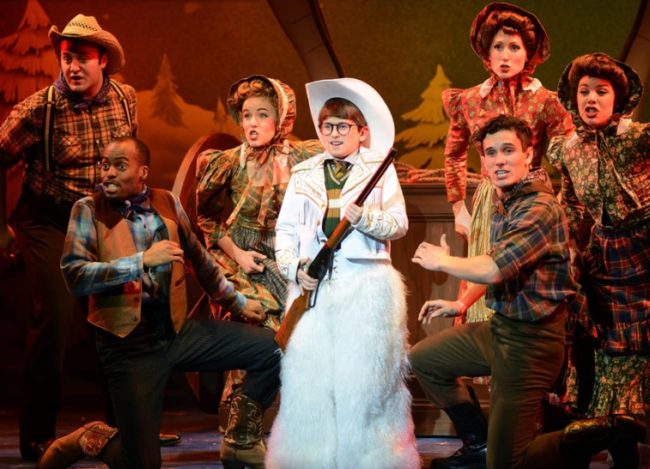 Austin Molinaro (center) as Ralphie and the ensemble performing "Ralphie to the Rescue!" in A Christmas Story the Musical