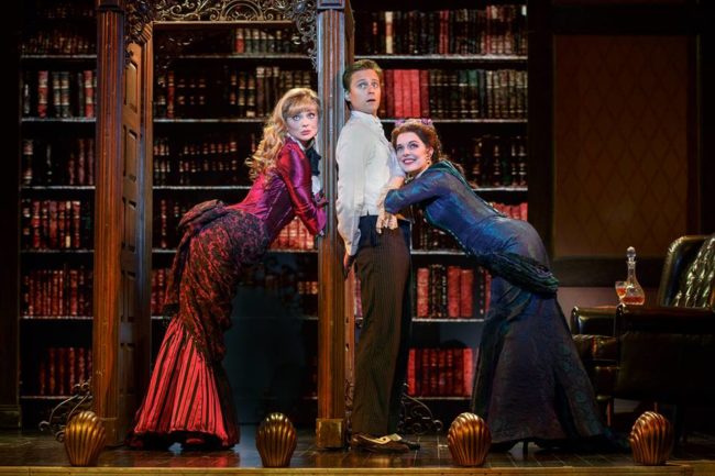 Kristen Beth Williams (left) as Sibella, Kevin Massey (center) as Monty Navarro, and Kristen Hahn (right) as Phoebe D'Ysquith