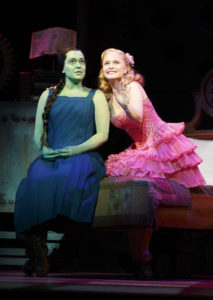 Jessica Vosk (left) as Elphaba and Amanda Jane Cooper (right) as Glinda in Wicked