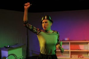 Barbara Madison Hauck as Lulu in Exit Pluto