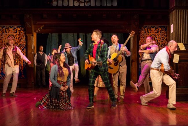 The cast of Folger Theatre’s production of Shakespeare’s As You Like It in exuberant song.