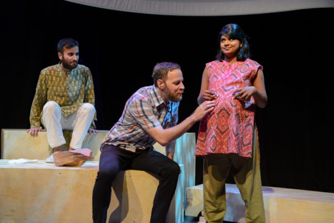 Unborn baby Amit (Utkarsh Rajawat) looks on as Craig (Paul Diem) listens to his heartbeat inside Suraiya (Saraniya Tharmarajah)