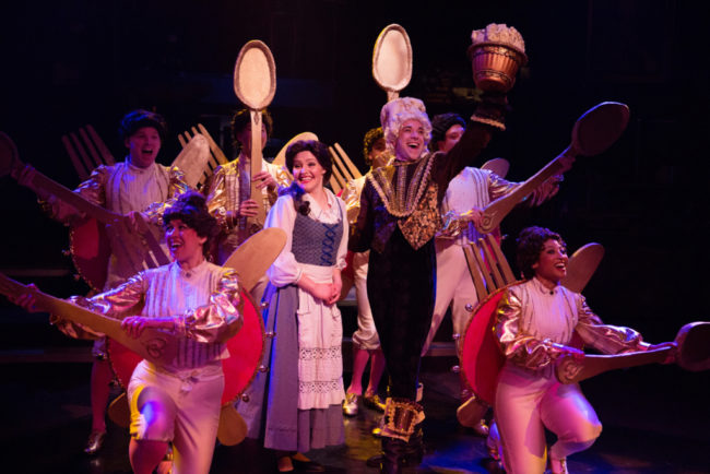 Nicki Elledge (center left) as Belle and Jeremy Scott Blaustein (center right) as Lumiere in Beauty & The Beast