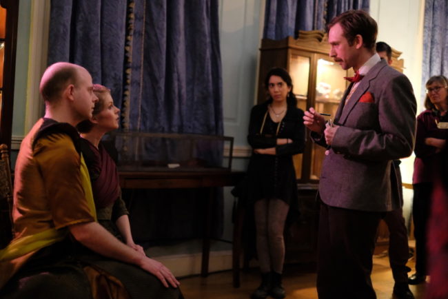 David Brasington (seated left) and Lisi Stoessel (seated right) and Alex Vernon (standing right) in a scene from H.T. Darling’s Incredible MUSÆUM 